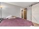 Bedroom with a sliding barn door and a minimal gray color scheme at 7904 Chase Cir # 146, Arvada, CO 80003