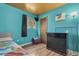 ' bedroom with bright turquoise walls, a gold ceiling, and a small window at 7904 Chase Cir # 146, Arvada, CO 80003