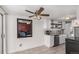 Bright kitchen with stainless steel appliances and custom shelving at 7904 Chase Cir # 146, Arvada, CO 80003
