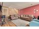 Spacious living room with wood-look floors and staircase at 7904 Chase Cir # 146, Arvada, CO 80003