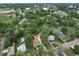Aerial view of the property highlighting the house, surrounding trees, and neighborhood at 3246 W 53Rd Ave, Denver, CO 80221