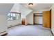 Cozy bedroom with carpet, closet, and a window unit for climate control at 3246 W 53Rd Ave, Denver, CO 80221