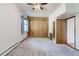 Cozy bedroom with built-in closet space, ceiling fan, and neutral carpet at 3246 W 53Rd Ave, Denver, CO 80221