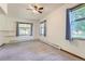 Bright bedroom with neutral carpet, ceiling fan, and natural light from multiple windows at 3246 W 53Rd Ave, Denver, CO 80221