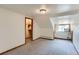 Attic bedroom featuring carpet, closet space, and a window unit for climate control at 3246 W 53Rd Ave, Denver, CO 80221