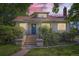 Inviting home entrance with concrete steps, decorative planters, and a secure front door at 3246 W 53Rd Ave, Denver, CO 80221