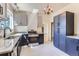 Updated kitchen with stainless steel appliances, granite countertops and stylish fixtures at 3246 W 53Rd Ave, Denver, CO 80221