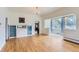 Spacious living room with hardwood floors, built-in shelving and sun room at 3246 W 53Rd Ave, Denver, CO 80221
