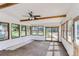 Bright sunroom with lots of natural light and multiple windows, and a ceiling fan at 3246 W 53Rd Ave, Denver, CO 80221