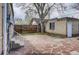 Quaint backyard with a stone patio and access to the garage at 3171 W 38Th Ave, Denver, CO 80211