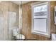 Bright bathroom with walk-in shower, natural-look tile, and large window at 3171 W 38Th Ave, Denver, CO 80211