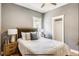 Cozy bedroom with neutral walls, a ceiling fan and hardwood floors at 3171 W 38Th Ave, Denver, CO 80211