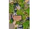 A bird's-eye view reveals a beautifully landscaped yard with a deck and winding pathways at 8262 Otis Ct, Arvada, CO 80003