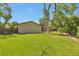 Expansive backyard featuring a lush lawn and privacy fence, ideal for outdoor activities at 8262 Otis Ct, Arvada, CO 80003