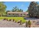 Landscaped backyard featuring lush greenery and an inviting entertainment area at 8262 Otis Ct, Arvada, CO 80003