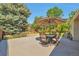 Backyard patio with stylish outdoor seating and lush landscaping at 8262 Otis Ct, Arvada, CO 80003