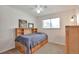 Cozy bedroom features a built-in bed with storage drawers and a wooden headboard at 8262 Otis Ct, Arvada, CO 80003