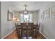 Dining room with wood table and chairs and a bay window at 8262 Otis Ct, Arvada, CO 80003