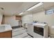 A functional laundry room with modern washer and dryer units at 8262 Otis Ct, Arvada, CO 80003