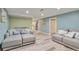 A cozy living room featuring neutral tones and comfortable seating arrangements at 8262 Otis Ct, Arvada, CO 80003