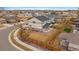 Aerial view of fenced backyard with well-maintained lawn and covered patio at 9608 Albion Ln, Thornton, CO 80229