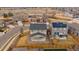 Aerial view of fenced backyard with well-maintained lawn and covered patio at 9608 Albion Ln, Thornton, CO 80229