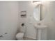 Half bathroom with pedestal sink, neutral paint and tile flooring at 9608 Albion Ln, Thornton, CO 80229