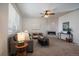 Bright living room featuring modern fireplace, contemporary furniture, and natural light, creating a relaxing atmosphere at 9608 Albion Ln, Thornton, CO 80229