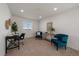 Carpeted loft space featuring a cozy sitting area and desk at 9608 Albion Ln, Thornton, CO 80229