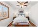 Comfortable bedroom with white linens, wood floors, and a window view at 1812 24Th Ave, Longmont, CO 80501