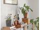 Cozy dining room details with bar cart, spirits, plants, and decor on a shelf at 1812 24Th Ave, Longmont, CO 80501