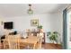 Open concept dining area with view into living room, featuring wooden table and stylish decor at 1812 24Th Ave, Longmont, CO 80501