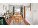 Light filled dining room features a wooden table, chairs, and view to the outside patio at 1812 24Th Ave, Longmont, CO 80501