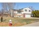 Charming two-story home with brick accents, neat landscaping, and an attached two-car garage at 1812 24Th Ave, Longmont, CO 80501