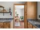 View from the kitchen showing light wood cabinets, granite countertop, and dining area at 1812 24Th Ave, Longmont, CO 80501