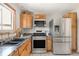 Updated kitchen with stainless steel appliances, light wood cabinets and granite countertops at 1812 24Th Ave, Longmont, CO 80501