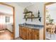 Open butler's pantry area between living and dining rooms with counter and view into each room at 1812 24Th Ave, Longmont, CO 80501