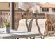 Outdoor seating area on the patio with a view of the backyard and fence at 1812 24Th Ave, Longmont, CO 80501