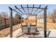 Backyard patio with a pergola, outdoor seating, and a view of the fenced yard at 1812 24Th Ave, Longmont, CO 80501