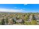 Expansive aerial view capturing the neighborhood landscape and city skyline under a clear, blue sky at 295 E Amherst Ave, Englewood, CO 80113