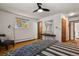 Spacious bedroom with hardwood floors, modern lighting, and stylish furnishings at 295 E Amherst Ave, Englewood, CO 80113