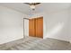 Cozy bedroom with natural light, neutral walls, and plush carpeting at 295 E Amherst Ave, Englewood, CO 80113