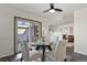 Charming dining area with glass-top table, comfortable chairs, and sliding doors to the exterior at 295 E Amherst Ave, Englewood, CO 80113