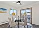 Inviting dining space featuring a glass table, seating for four with view of mature trees at 295 E Amherst Ave, Englewood, CO 80113