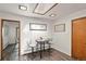 Cozy dining area features a skylight, stylish decor, and wood-look flooring at 295 E Amherst Ave, Englewood, CO 80113