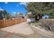 Brick house with a long driveway leading to a detached garage and fenced backyard at 295 E Amherst Ave, Englewood, CO 80113