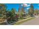 Well maintained brick home with mature trees and landscaping in a suburban neighborhood at 295 E Amherst Ave, Englewood, CO 80113