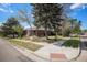 Charming one-story brick home with mature trees and landscaping at 295 E Amherst Ave, Englewood, CO 80113