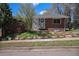 Charming brick home with a well-maintained front yard and walkway at 295 E Amherst Ave, Englewood, CO 80113