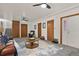 Open living room featuring hardwood doors, carpet, and neutral paint providing a canvas for personal style at 295 E Amherst Ave, Englewood, CO 80113